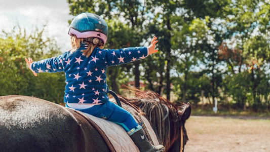 How to Support Your Child’s Riding Journey (Without Hovering at the Rail)